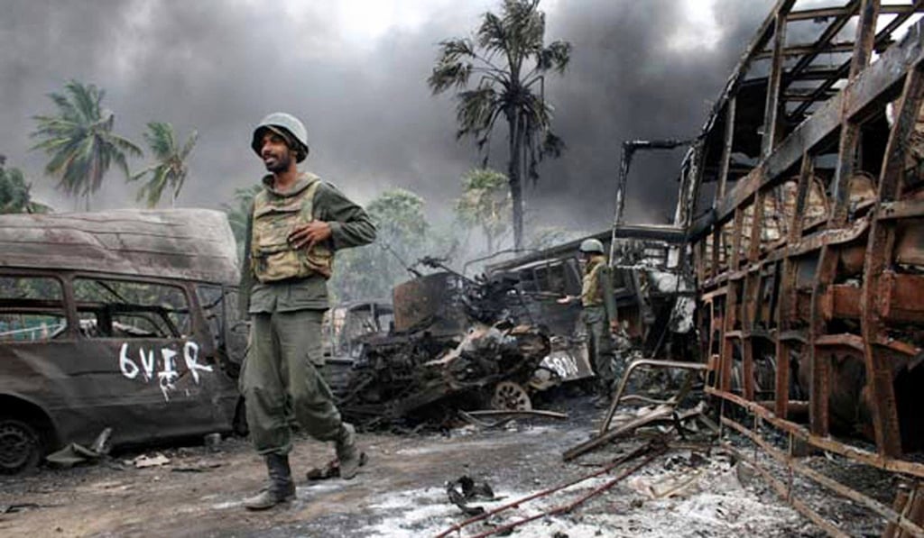 Sri Lankan troops walking among debris on the last day of the war. Photo: AFP