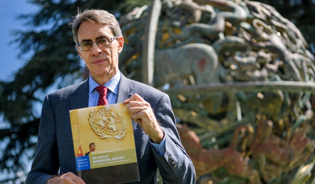 Executive director of Human Rights Watch, Kenneth Roth, pictured with a copy of the new report. Photo: AFP