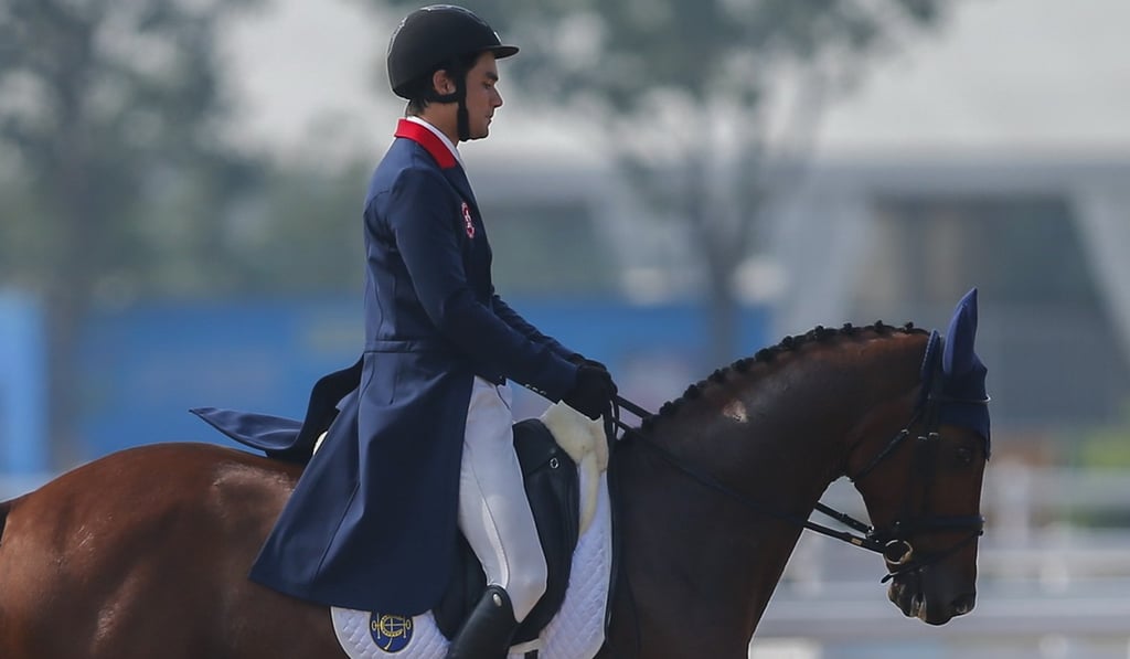 Thomas Ho on his way to receiving 49.7 penalty points in the dressage. Photo: HKJC Thomas Ho on his way to receiving 49.7 penalty points in the dressage. Photo: HKJC