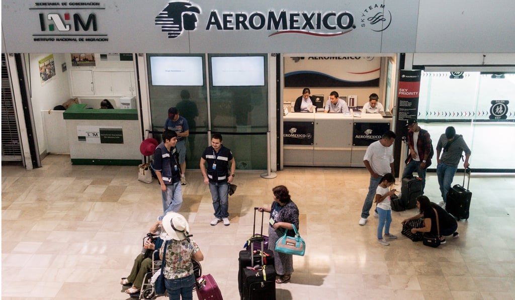 Travellers stand in front of an Aeromexico counter at the airport in Puerto Vallarta, Mexico. Two airlines, Aeromexico and China Southern, now directly connect Mexico and China, with eight weekly flights. Photo: Bloomberg