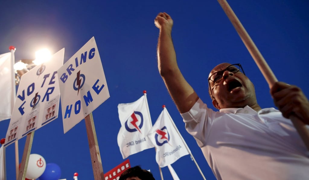 People attend an election campaign rally by the ruling People's Action Party in Singapore, in September, 2015. During each general election, the PAP requests a third of its MPs give up their seats for new candidates. Photo: Reuters