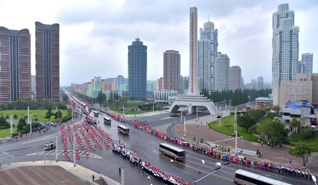 Pyongyang residents line the capital’s streets ahead of the big event. Photo: AFP