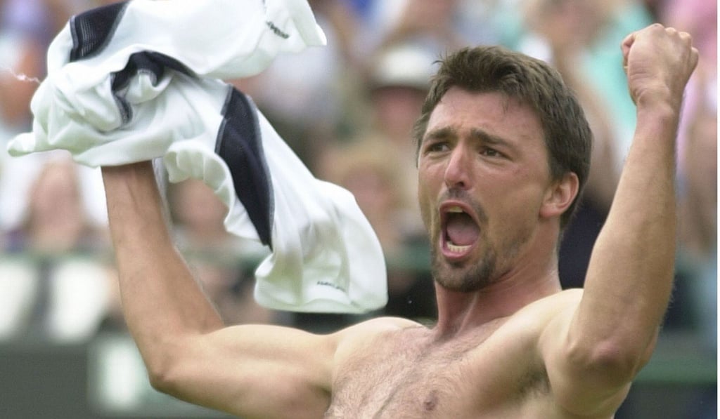 Goran Ivanisevic of Croatia celebrates after defeating Andy Roddick of the US, during their men's singles, third round match at Wimbledon, Friday June 29, 2001. Photo: AP