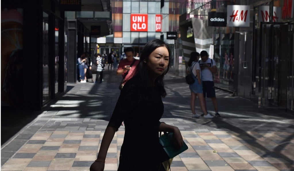 Shoppers visit a mall in Beijing. Since China launched its amazing market reforms four decades ago, the world has experienced a series of revolutions that affected all aspects of the human condition: technologically, geopolitically, demographically, socially, ecologically and economically. Photo: AFP