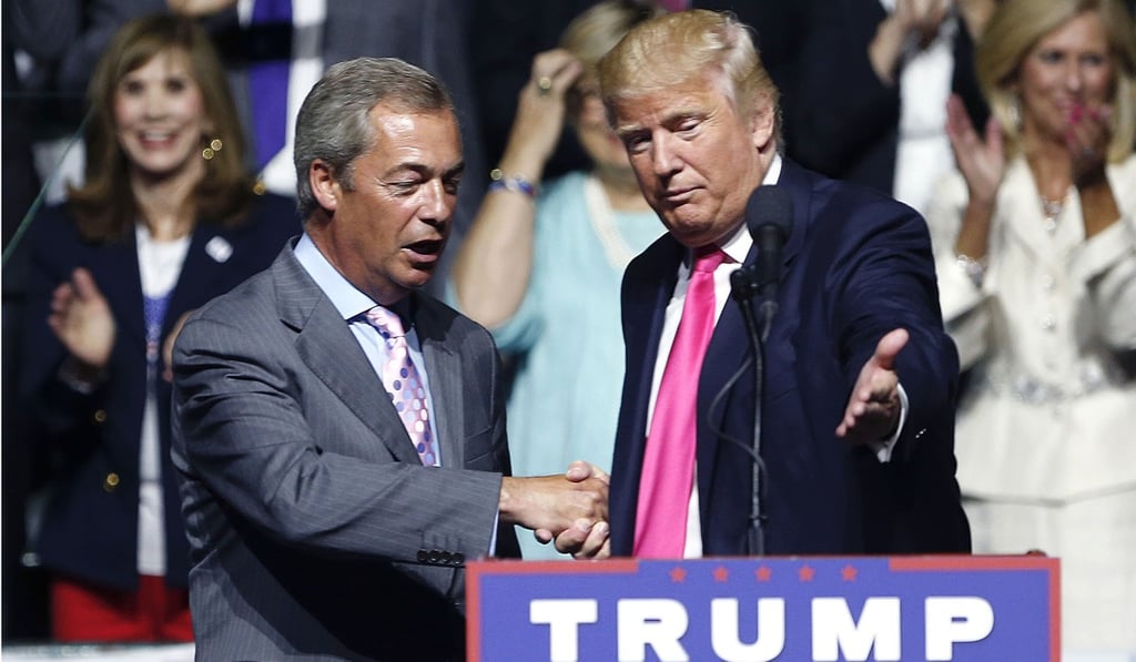 In this August 24, 2016, photo, then-Republican presidential candidate Donald Trump, right, welcomes pro-Brexit British politician Nigel Farage, to speak at a campaign rally in Jackson, Mississippi. Photo: AP