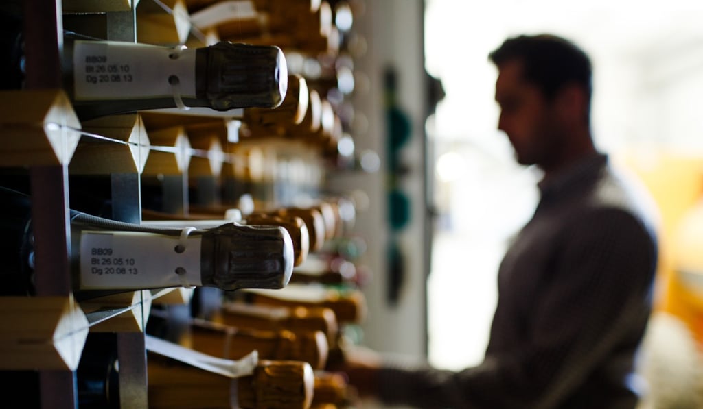 Inside Gusbourne Estate’s winery lies thousands of bottles of fine wine. Inside Gusbourne Estate’s winery lies thousands of bottles of fine wine.