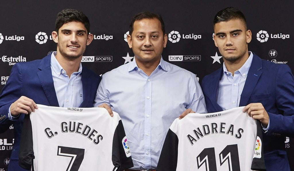 Valencia president Anil Murthy with new players Andreas Pereira and Goncalo Guedes. Photo: EPA