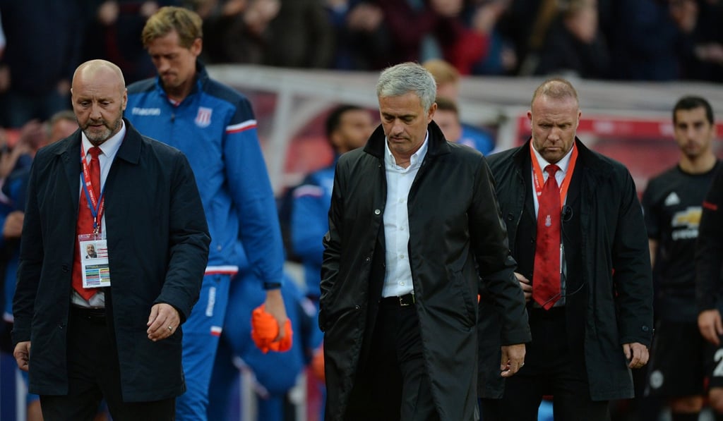 Jose Mourinho walked off the pitch without shaking Mark Hughes’ hand. Photo: Reuters