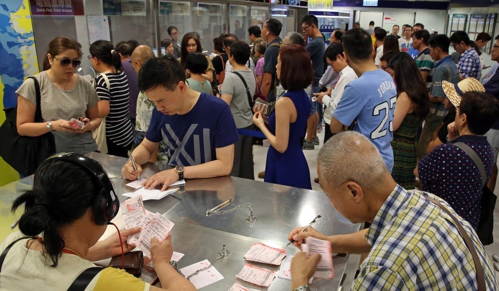 People queue up for the Mark Six at a Hong Kong Jockey Club betting branch in Central, in 2016. Picture: Sam Tsang