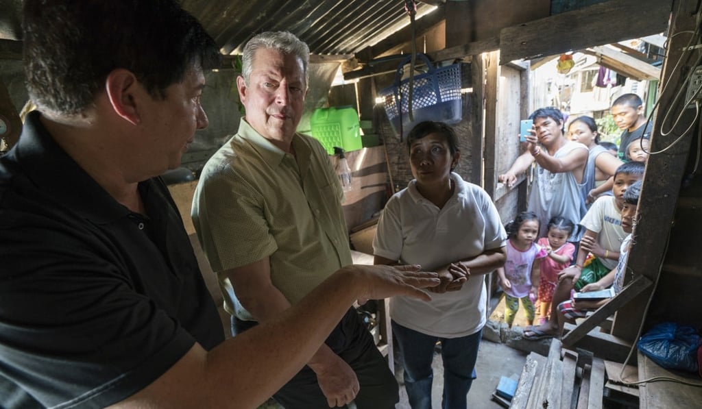 Gore in the Philippines in 2016 with Alfred Romualdez, former mayor of Tacloban City, and Typhoon Haiyan survivor Demi Raya in a still from the film. Gore in the Philippines in 2016 with Alfred Romualdez, former mayor of Tacloban City, and Typhoon Haiyan survivor Demi Raya in a still from the film.