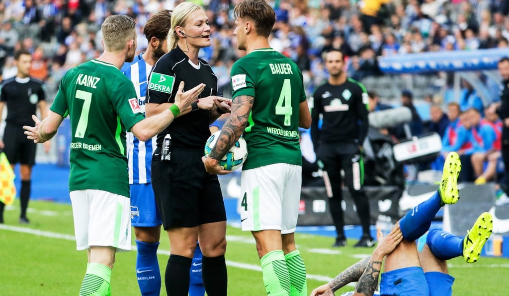 Referee Bibiana Steinhaus talks to Bremen’s Robert Bauer (2-R) during the German Bundesliga soccer match between Hertha BSC and Werder Bremen at the Olympic Stadium in Berlin, Germany. Photo: EPA Referee Bibiana Steinhaus talks to Bremen’s Robert Bauer (2-R) during the German Bundesliga soccer match between Hertha BSC and Werder Bremen at the Olympic Stadium in Berlin, Germany. Photo: EPA