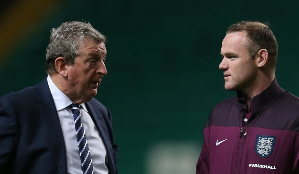 Roy Hodgson (left), pictured with Wayne Rooney, is touted as a possible replacement for Frank de Boer. Photo: AFP Roy Hodgson (left), pictured with Wayne Rooney, is touted as a possible replacement for Frank de Boer. Photo: AFP