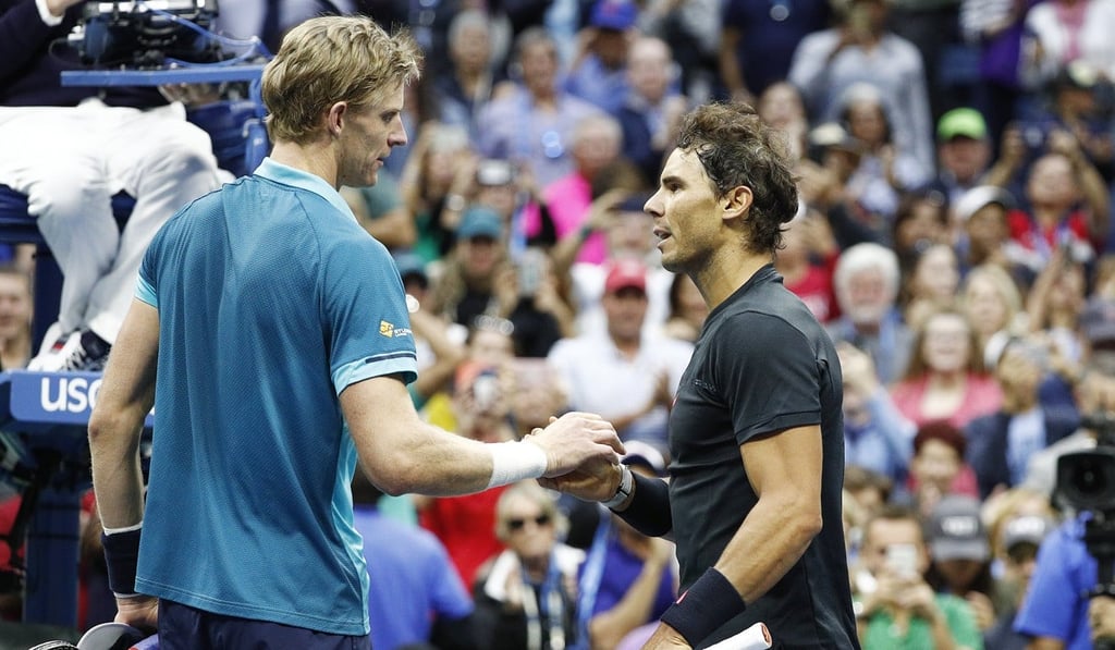 Nadal is congratulated by Anderson at the net after their US Open final . Photo: EPA