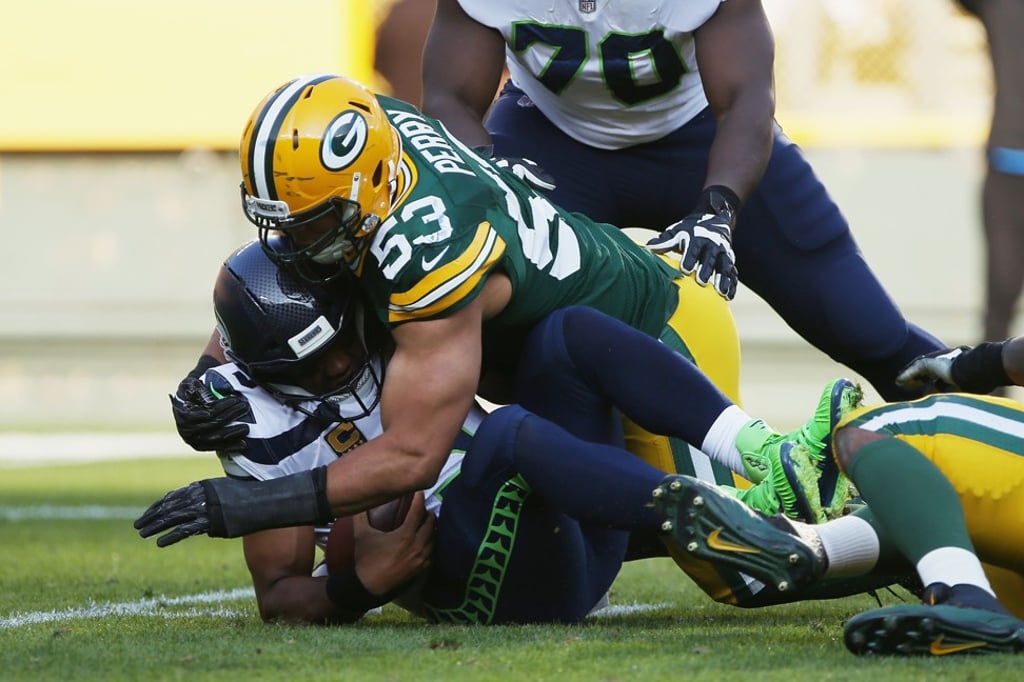 Nick Perry of the Green Bay Packers sacks Russell Wilson of the Seattle Seahawks. Photo: AFP