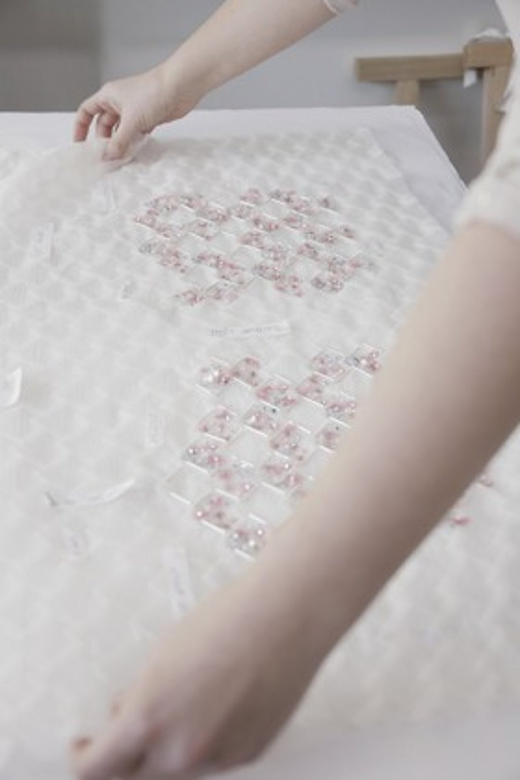 An artisan works on Chanel fabric, which is featured in the autumn/winter 2017 couture collection. An artisan works on Chanel fabric, which is featured in the autumn/winter 2017 couture collection.