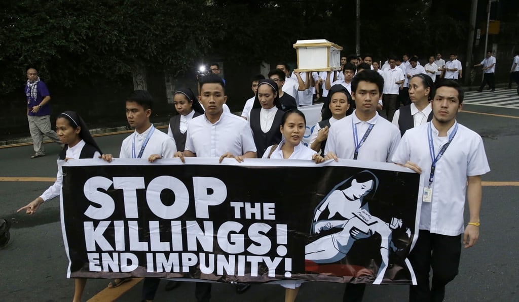 Seminarians and nuns protest against President Duterte’s war on drugs. Photo: AP Seminarians and nuns protest against President Duterte’s war on drugs. Photo: AP