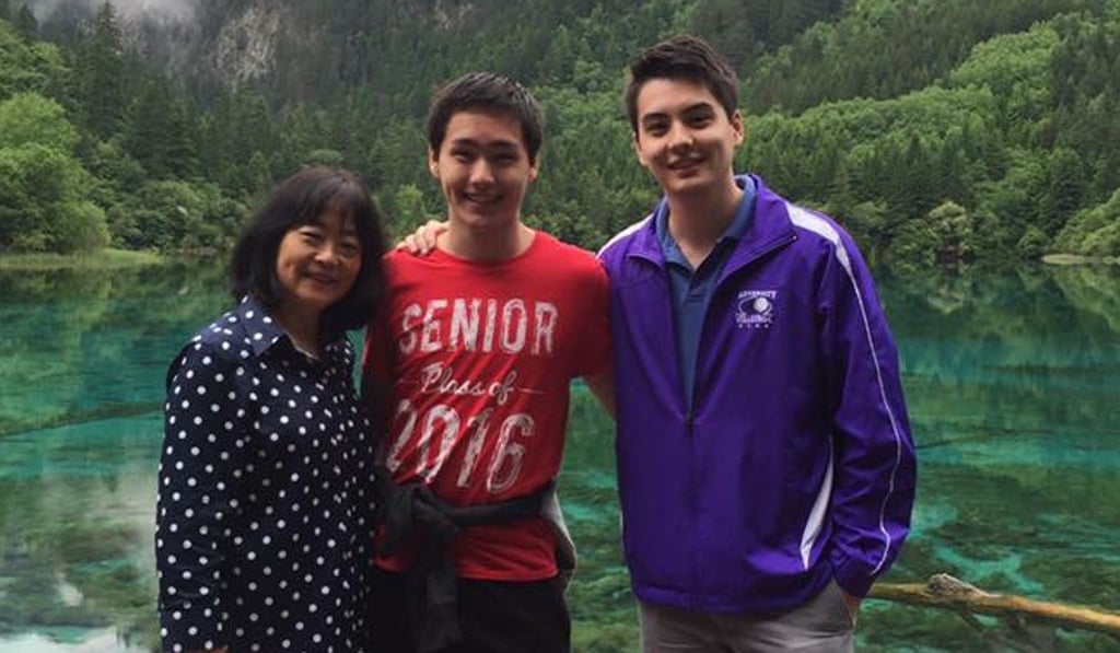 Eric Stinehart (centre) with his mother Yvette and brother James. Photo: Handout