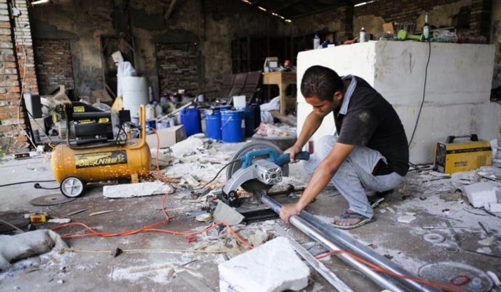 One of the enthusiasts pictured inside his workshop. Photo: Handout