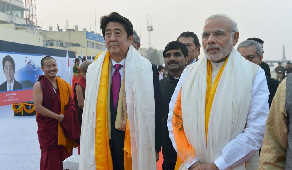 India's Prime Minister Narendra Modi and Japan's Prime Minister Shinzo Abe are given a traditional welcome upon their arrival in Varanasi, India's holiest city in 2015. File photo: AFP