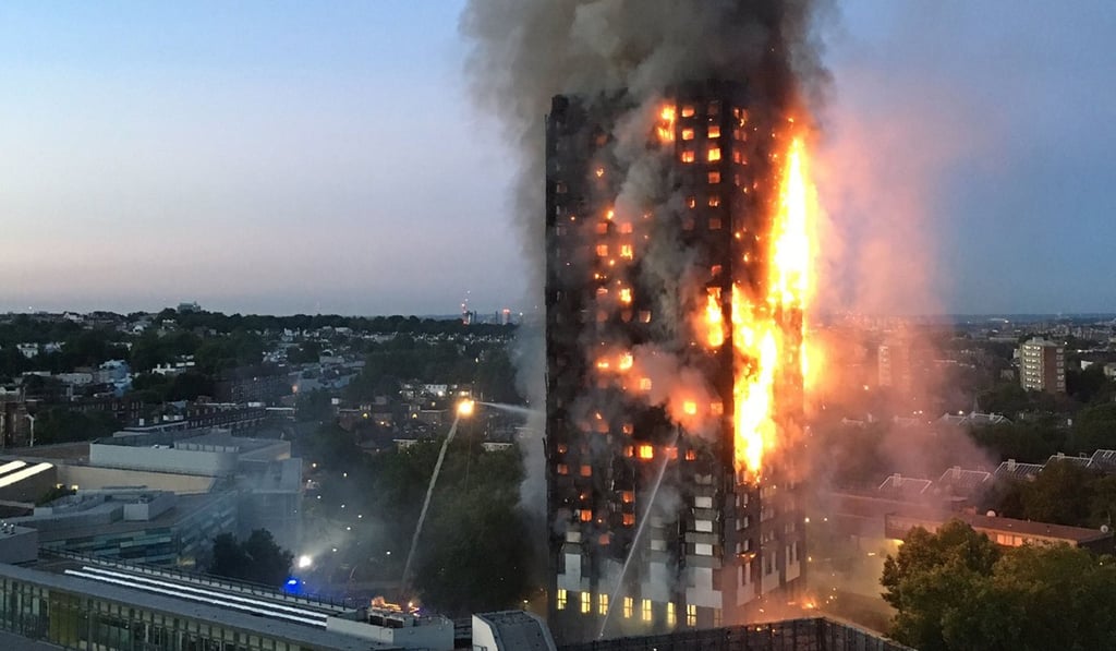 Flames and smoke billow from the 24-storey Grenfell Tower in west London in June. Photo: AFP / Natalie Oxford