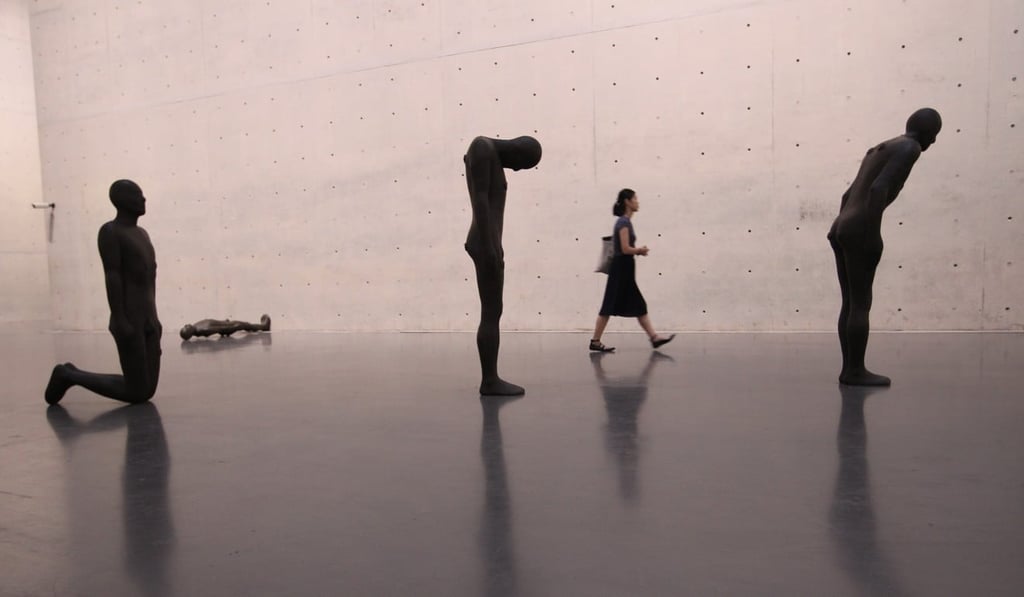 Sixty sculptures captured in various poses make up Gormley’s Critical Mass collection. Photo: Simon Song