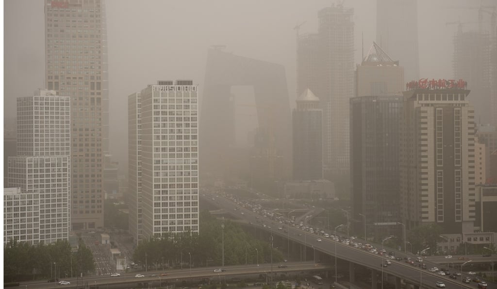 A dust storm shrouds Beijing’s central business district in May. Photo: AFP A dust storm shrouds Beijing’s central business district in May. Photo: AFP