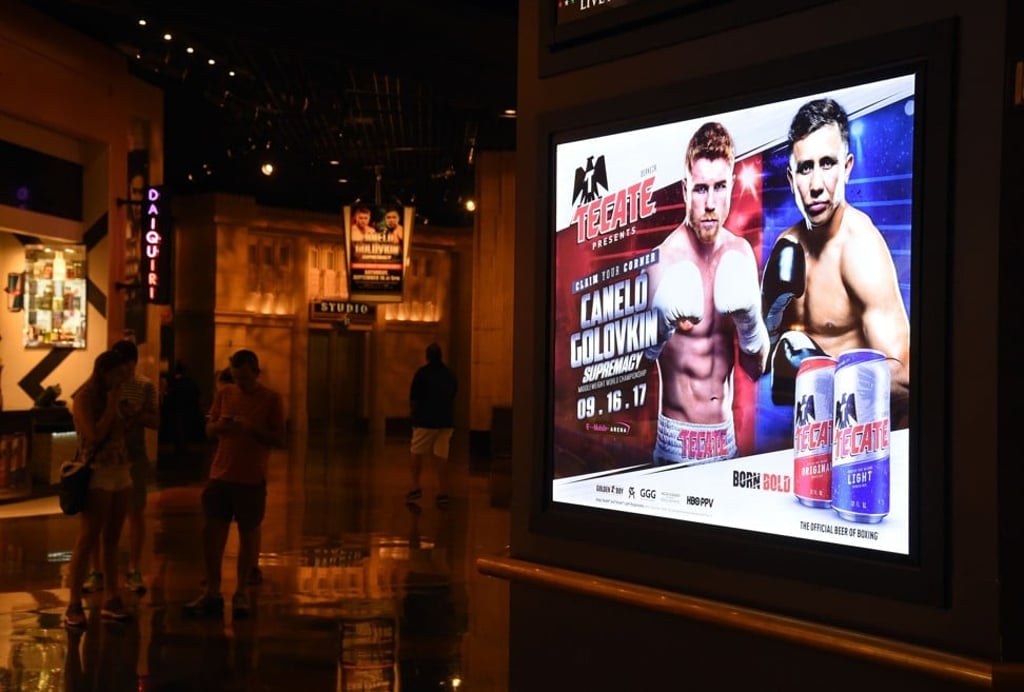 A poster at MGM Grand Hotel and Casino advertises the fight between WBC, WBA and IBF middleweight champion Golovkin and Alvarez. Photo: AFP A poster at MGM Grand Hotel and Casino advertises the fight between WBC, WBA and IBF middleweight champion Golovkin and Alvarez. Photo: AFP