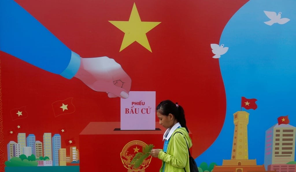 A girl walks past a poster promoting Vietnam’s 14th National Assembly election in Hanoi last year. The ruling party has launched a crackdown on dissenting voices as the US has relaxed its push for improved human rights in the country. Photo: Reuters