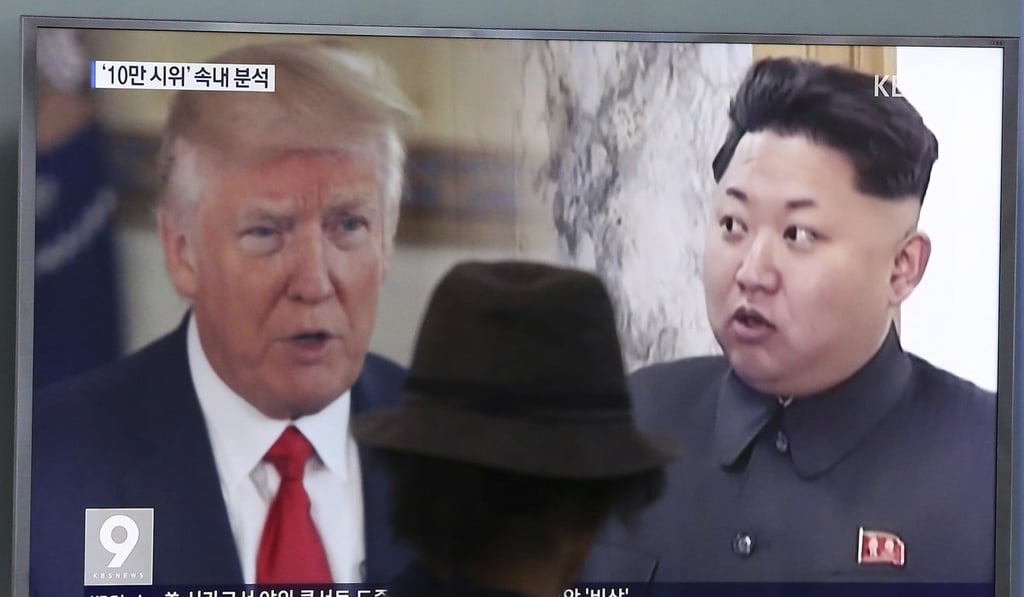 South Korean television shows images of US President Donald Trump and North Korean leader Kim Jong-un as tensions intensify over new tough sanctions on the reclusive nation. Photo: AP