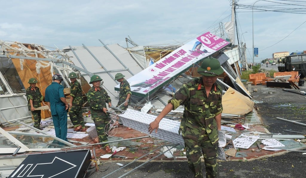 Soldiers start the clean-up in the central province of Ha Tinh after Typhoon Doksuri hit Vietnam’s coast. Photo: AFP