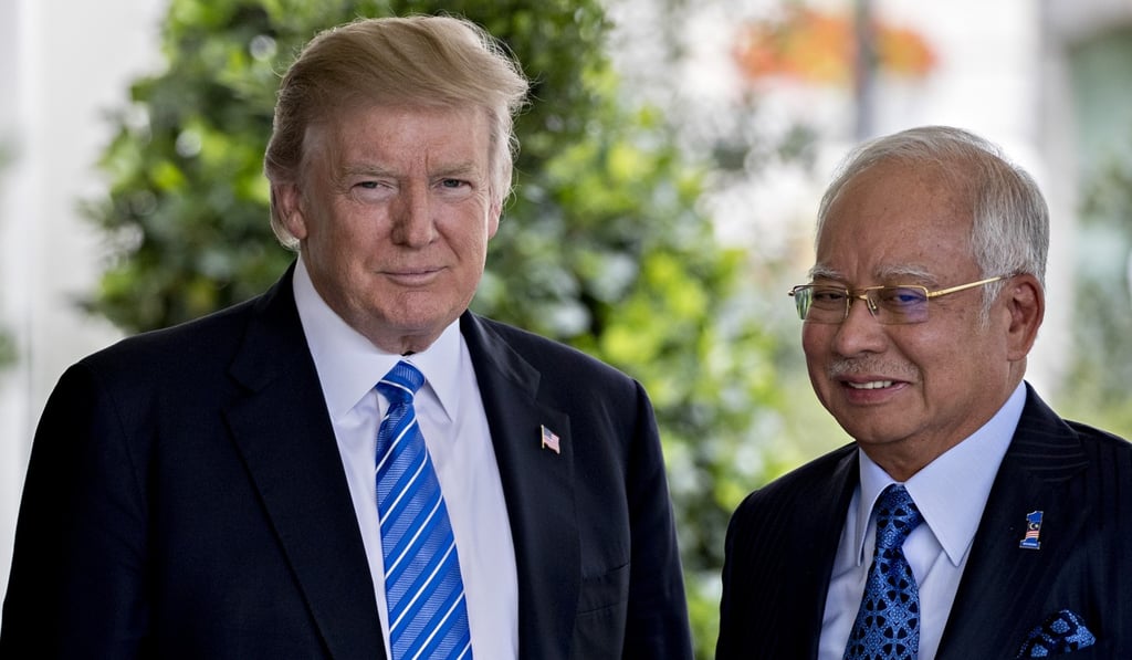 US President Donald Trump greets and Malaysian Prime Minister Najib Razak at the White House. Photo: Bloomberg