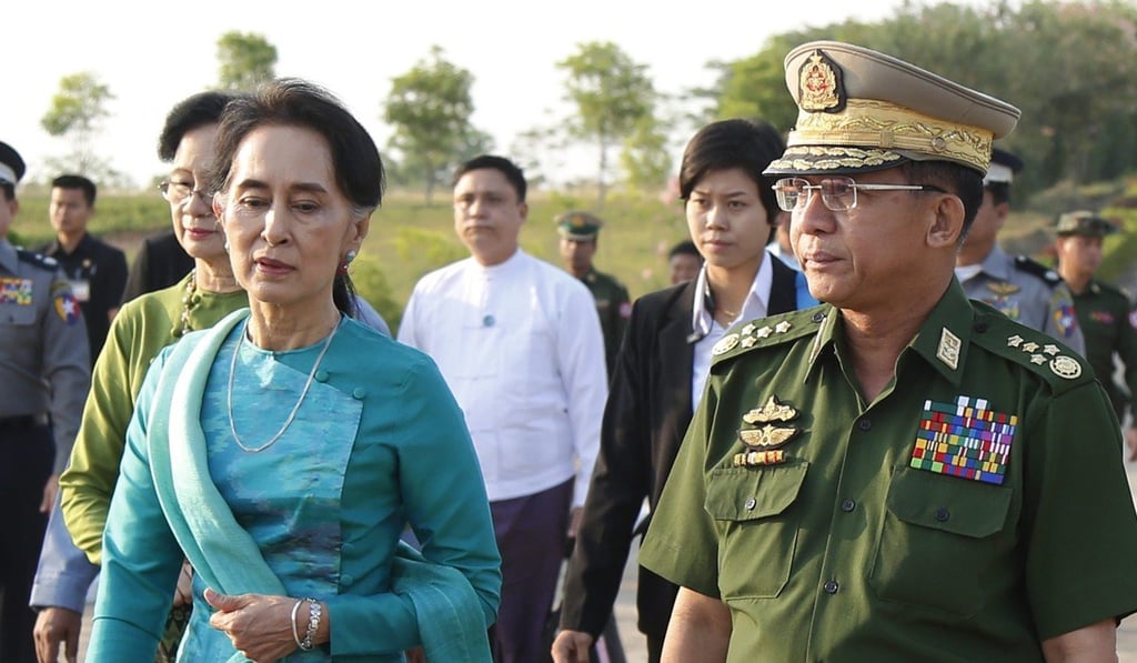 State Counsellor Aung San Suu Kyi alongside Senior General Min Aung Hlaing. Photo: EPA
