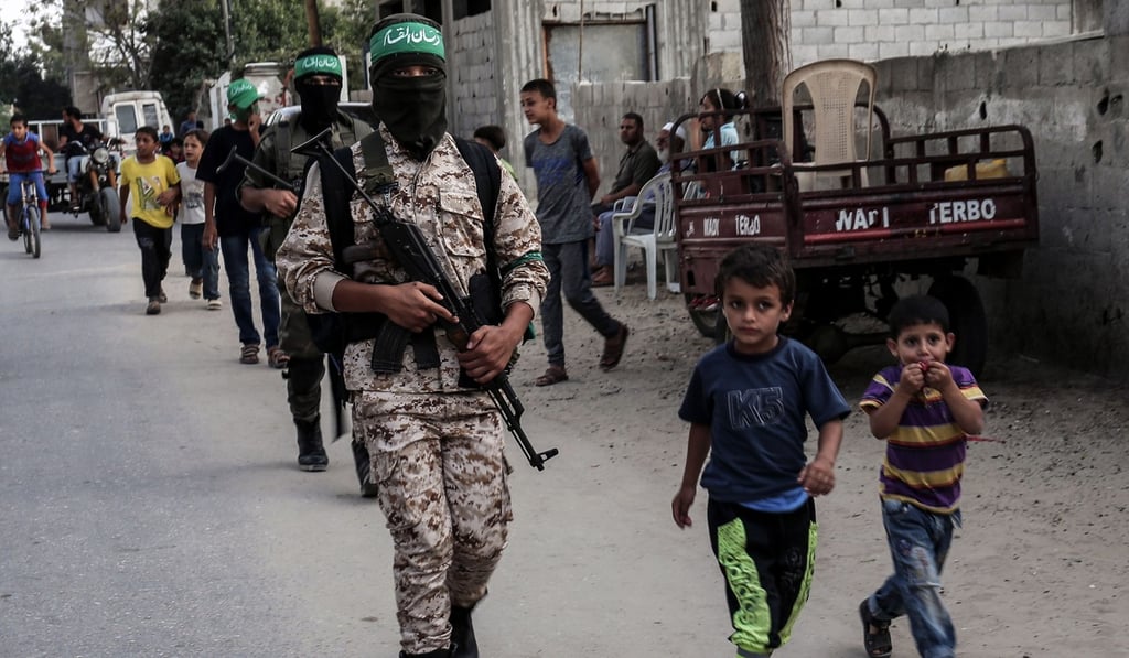 Masked youth cadets from the Ezzedine al-Qassam Brigades, the armed wing of the Palestinian Islamist Hamas movement, march in the southern Gaza Strip city of Khan Yunis. Photo: AFP