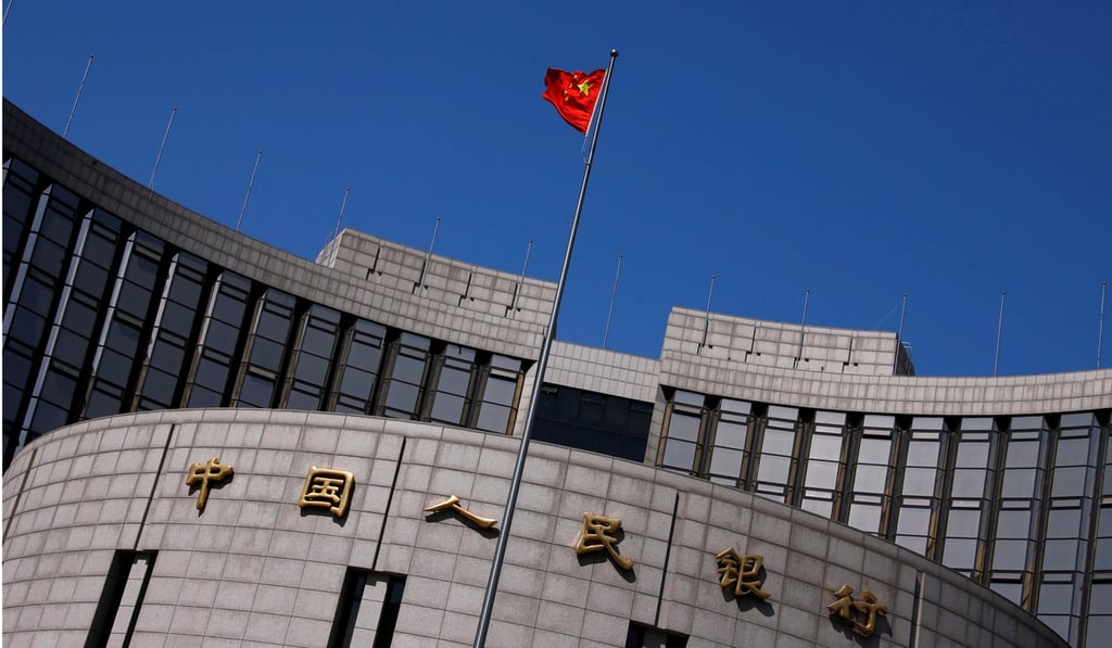 FA Chinese national flag flutters outside the headquarters of the People's Bank of China, the Chinese central bank, in Beijing. Photo: A Chinese national flag flutters outside the headquarters of the People’s Bank of China, the Chinese central bank, in Beijing
