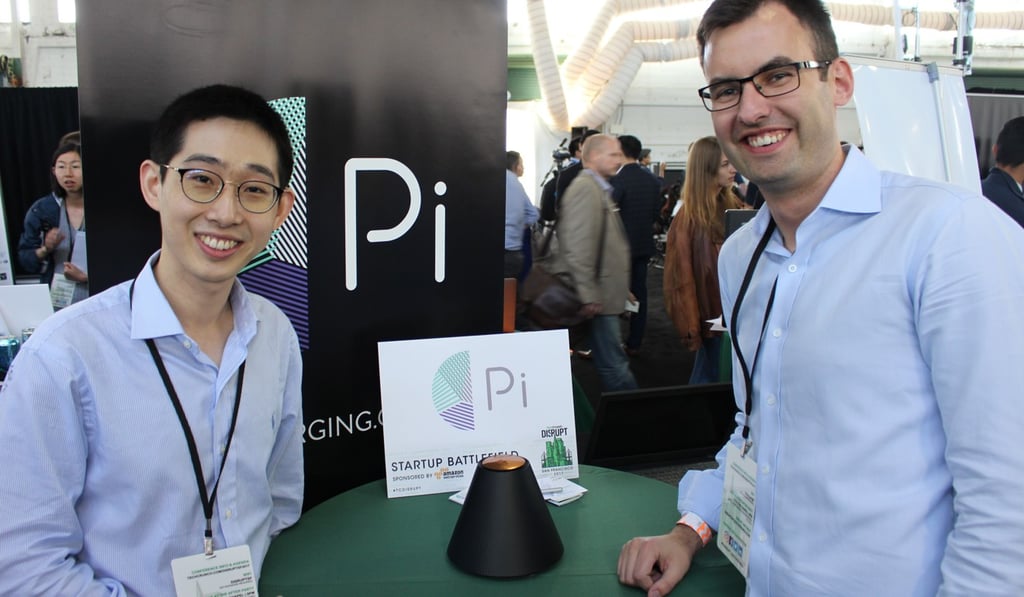 Pi co-founders Lixin Shi (left) and John MacDonald pose for a picture at a TechCrunch Disrupt technology conference in San Francisco with the world's first wireless charger that does away with the need to lay devices on charging mats. Photo: AFP