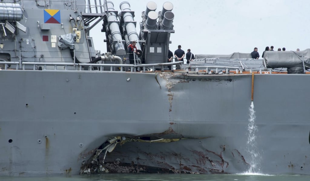 A huge dent and hole is seen in the hull of the guided-missile destroyer USS John S. McCain at Changi naval base in Singapore last month. Photo: AP