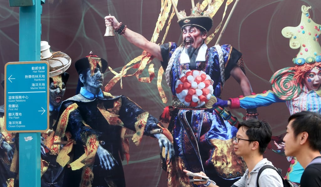 Tourists walk pass the haunted house