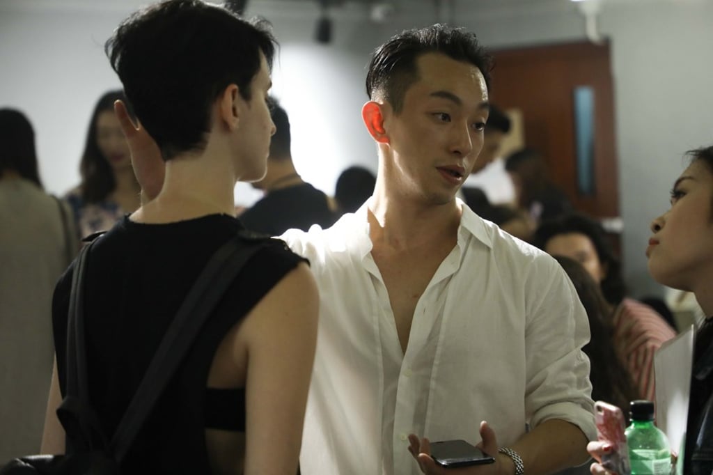 Moiselle’s creative director Harris Chan working with the models backstage.