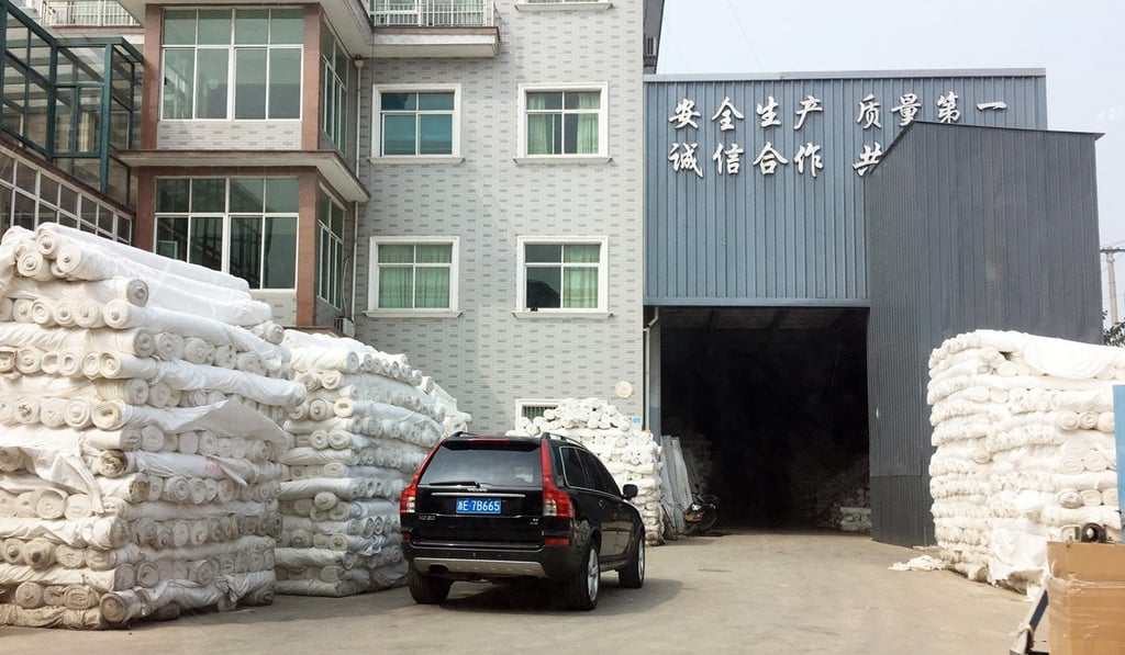 Rolls of cloth outside a household textile factory in Jiapu, Zhejiang. Photo: Mandy Zuo