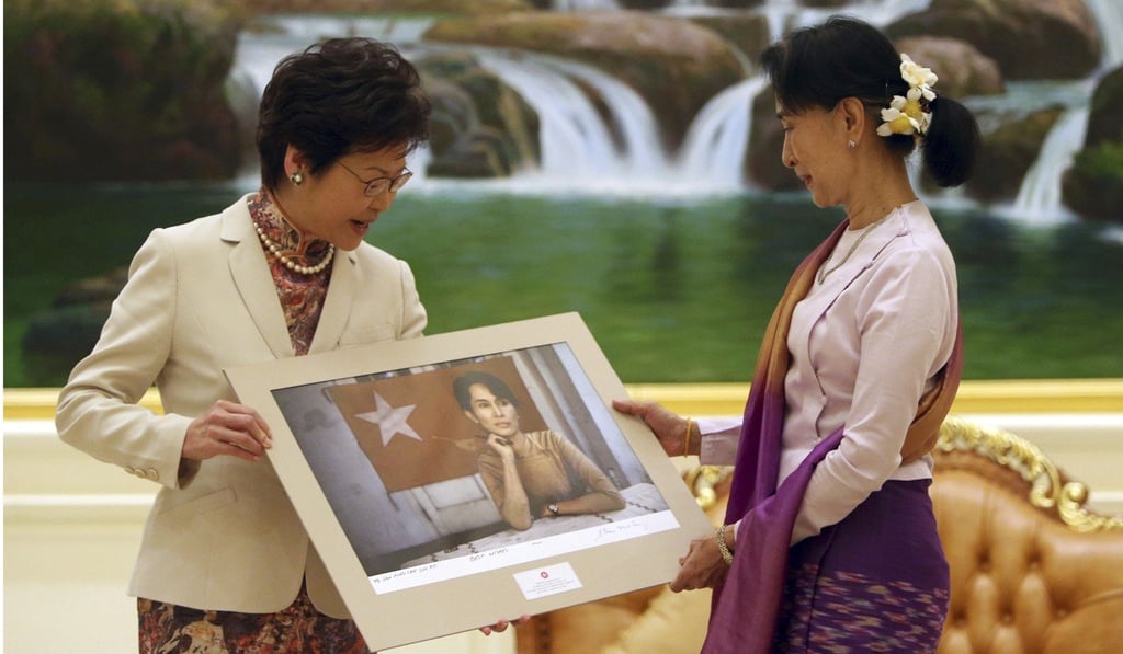 Visiting Hong Kong Chief Executive Carrie Lam (left) gives a portrait to Myanmar’s State Counsellor Aung San Suu Kyi, after a meeting at the presidential palace in Naypyidaw, Myanmar, on September 15. Photo: AP