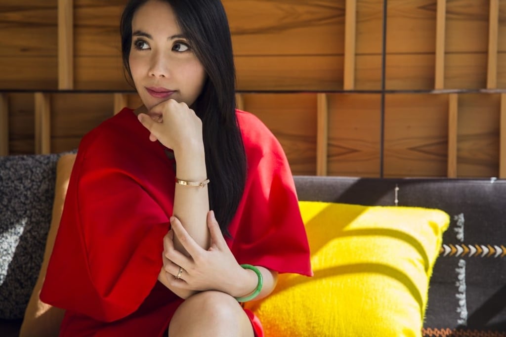 Red lace-up dress by Renamed, a gold bracelet by Hermès, and a jade bangle. Photo: Michelle Wong