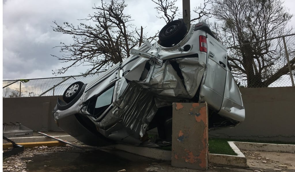 Cars were flipped, roofs of houses were torn off and trees were flattened as Hurricane Maria passed Puerto Rico. Photo: EPA Cars were flipped, roofs of houses were torn off and trees were flattened as Hurricane Maria passed Puerto Rico. Photo: EPA