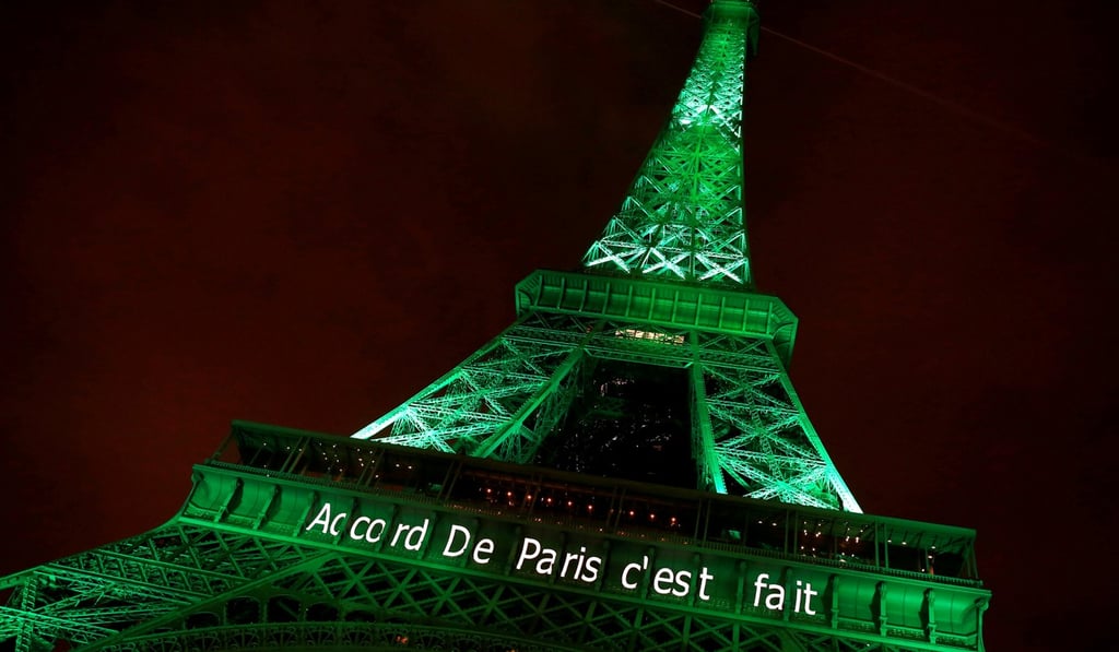 Eiffel tower, after the Paris Agreement came into force on November 4, 2016, illuminated with the words “Paris Agreement is made”. Photo: Reuters