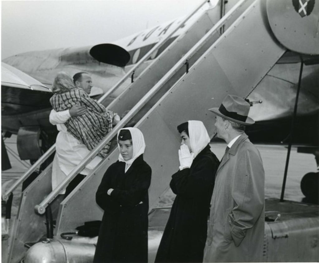 White Russian refugees boarding a plane in Hong Kong.
