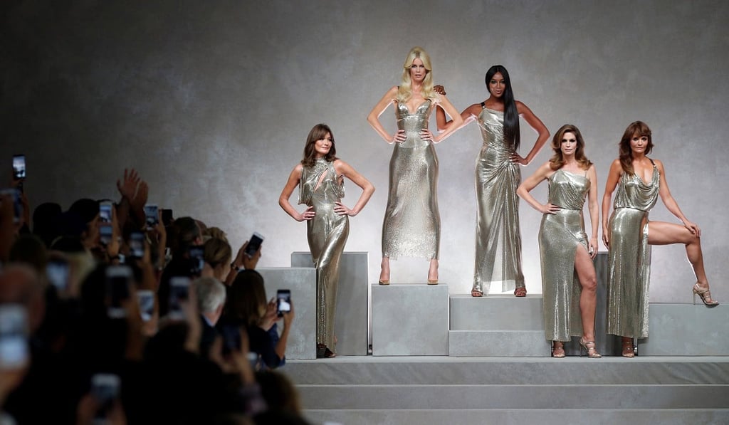 Former top models (L-R) Carla Bruni , Claudia Schiffer, Naomi Campbell, Cindy Crawford and Helena Christensen display iconic creations of the late Italian designer Gianni Versace during the Versace show at Milan Fashion Week. Photo: Reuters