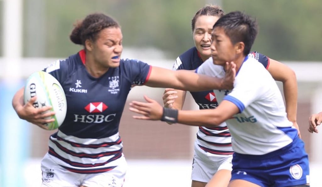 Natasha Olson-Thorne fends off an opponent during the first round of the Asia Women's Rugby Sevens Series. Natasha Olson-Thorne fends off an opponent during the first round of the Asia Women's Rugby Sevens Series.