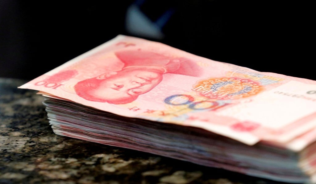 Chinese 100 yuan banknotes are seen on a counter of a branch of a commercial bank in Beijing. Photo: Reuters