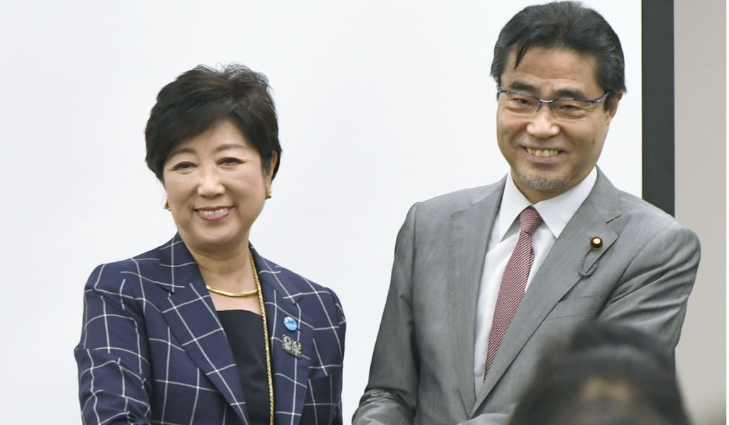 Wakasa with his close ally Tokyo Governor Yuriko Koike. Photo: Kyodo