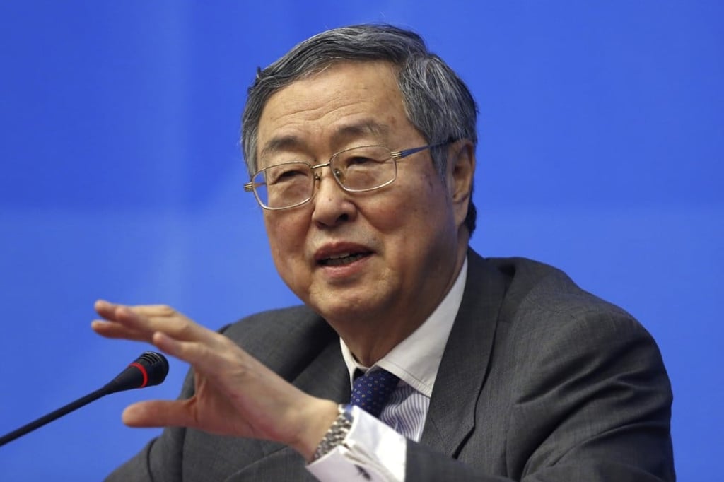 Zhou Xiaochuan, governor of the People’s Bank of China, seen here in a file photo, told a press conference in March that the central bank encouraged the development of technologies such as digital currency and blockchain. Chinatopix via AP.