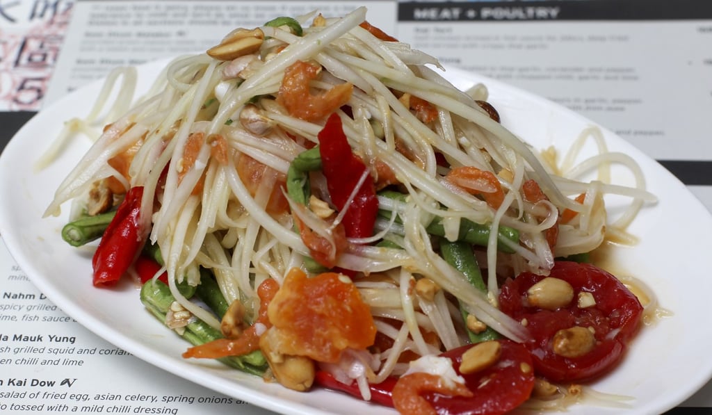 Pounded green papaya salad with cherry tomatoes, chilli, dried shrimp and salted duck egg from Chachawan. Photo: K.Y. Cheng